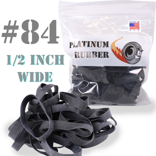 A pack of black rubber bands labeled as #84 size, indicating they are 1/2 inch wide. The pack is marked as a 1-LB bag, containing approximately 200 rubber bands.